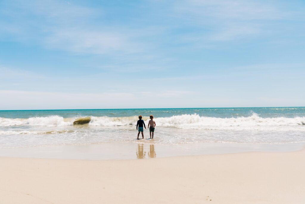 Kids take the surf in Cape Lookout, NC