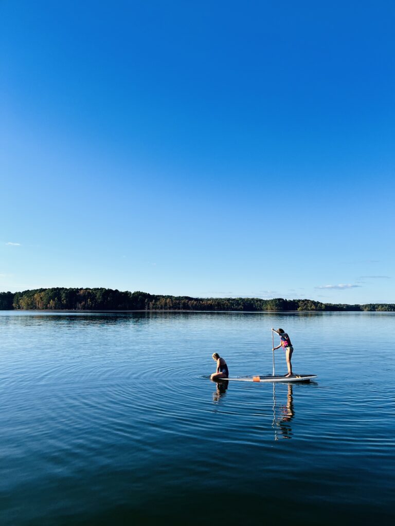 Girls on a paddle board in Kerr Lake, NC