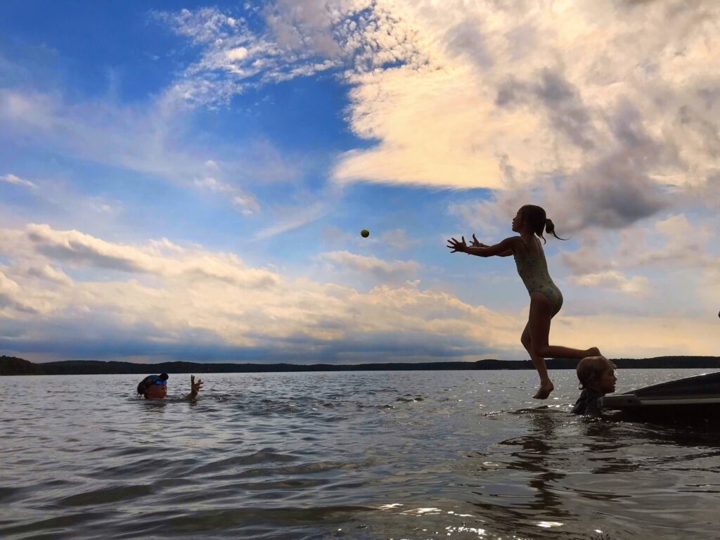 Girl jumps into water at Jordan Lake, NC